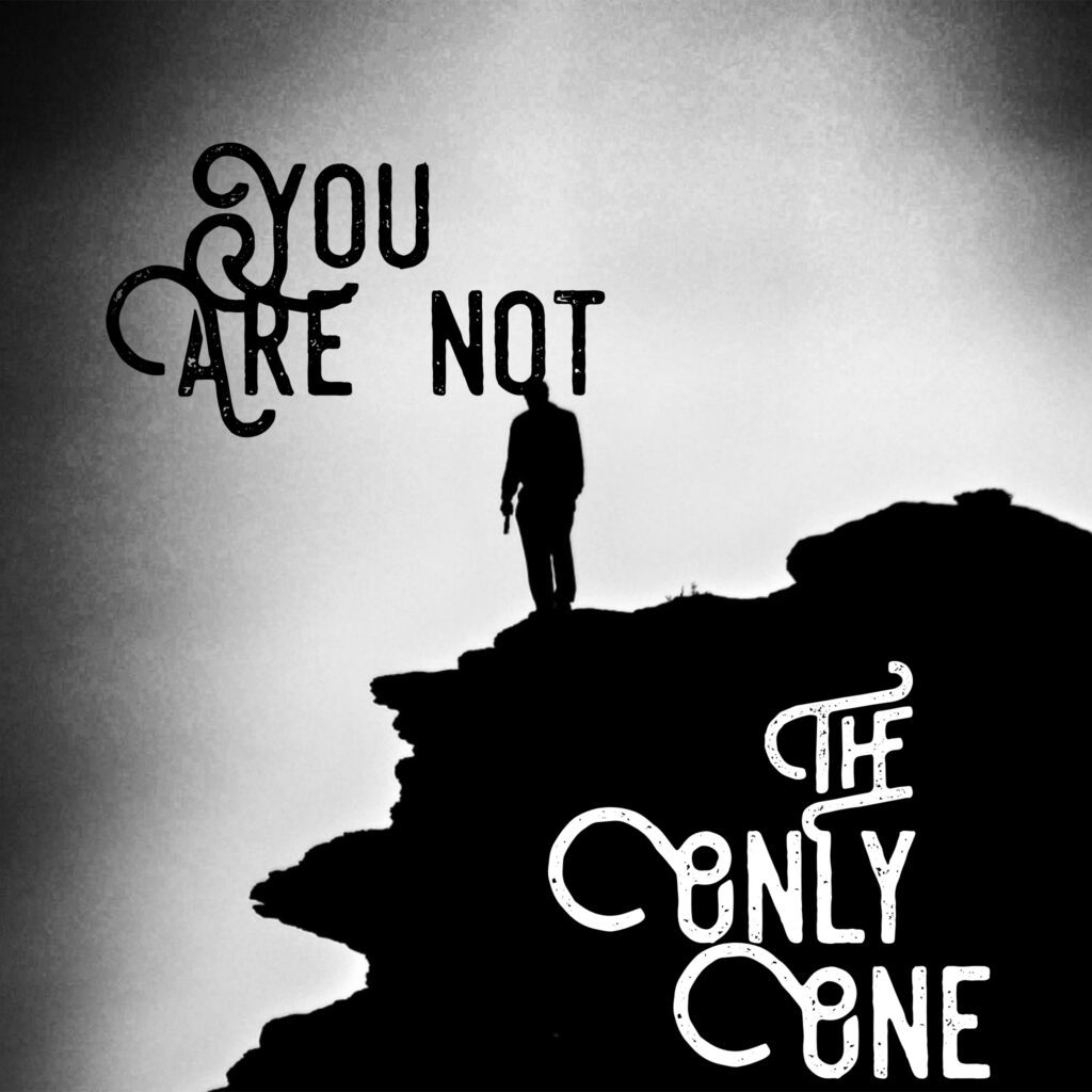 A person standing on top of a hill with words