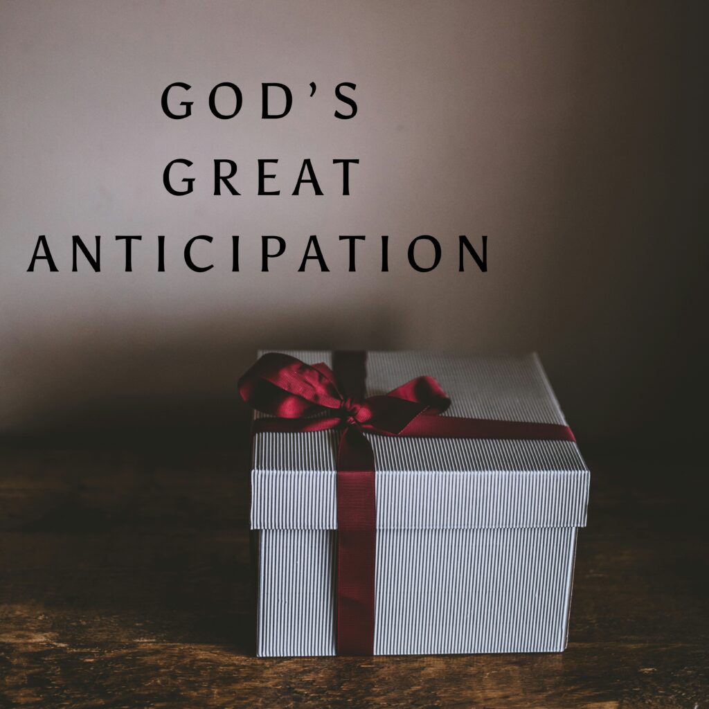 A white gift box with red ribbon and god 's great anticipation written on the side.