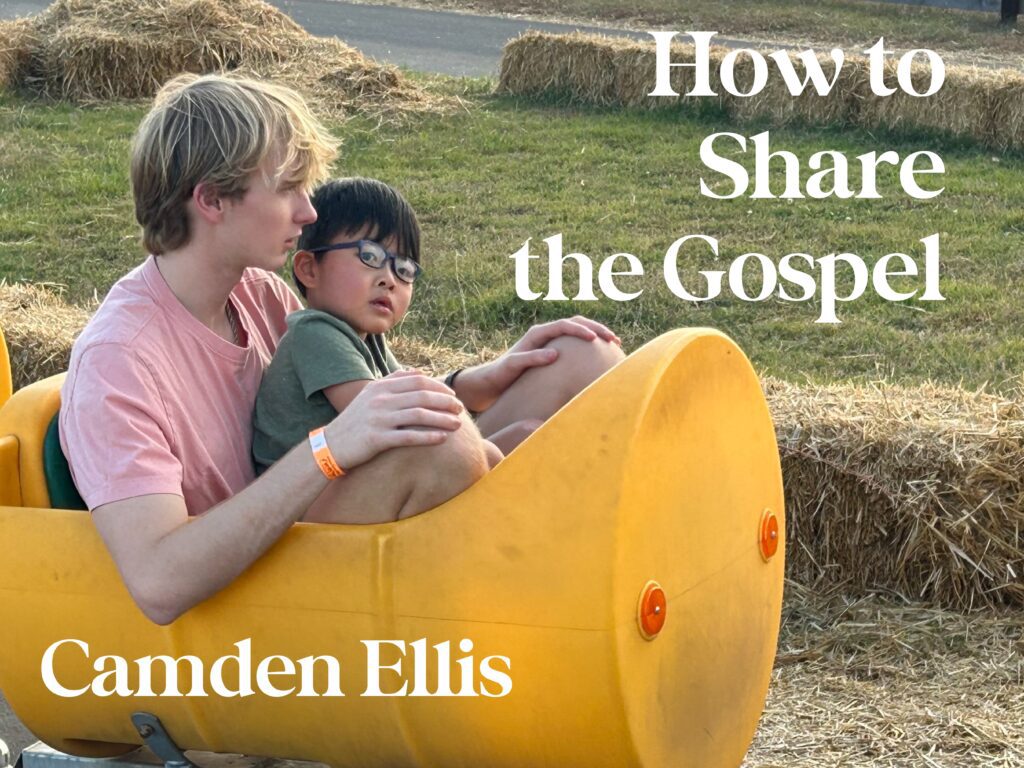 A man and boy sitting on top of a yellow barrel.