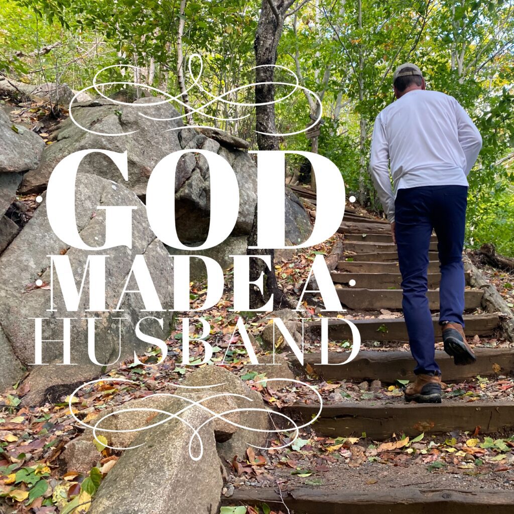 A man walking up some steps in the woods.