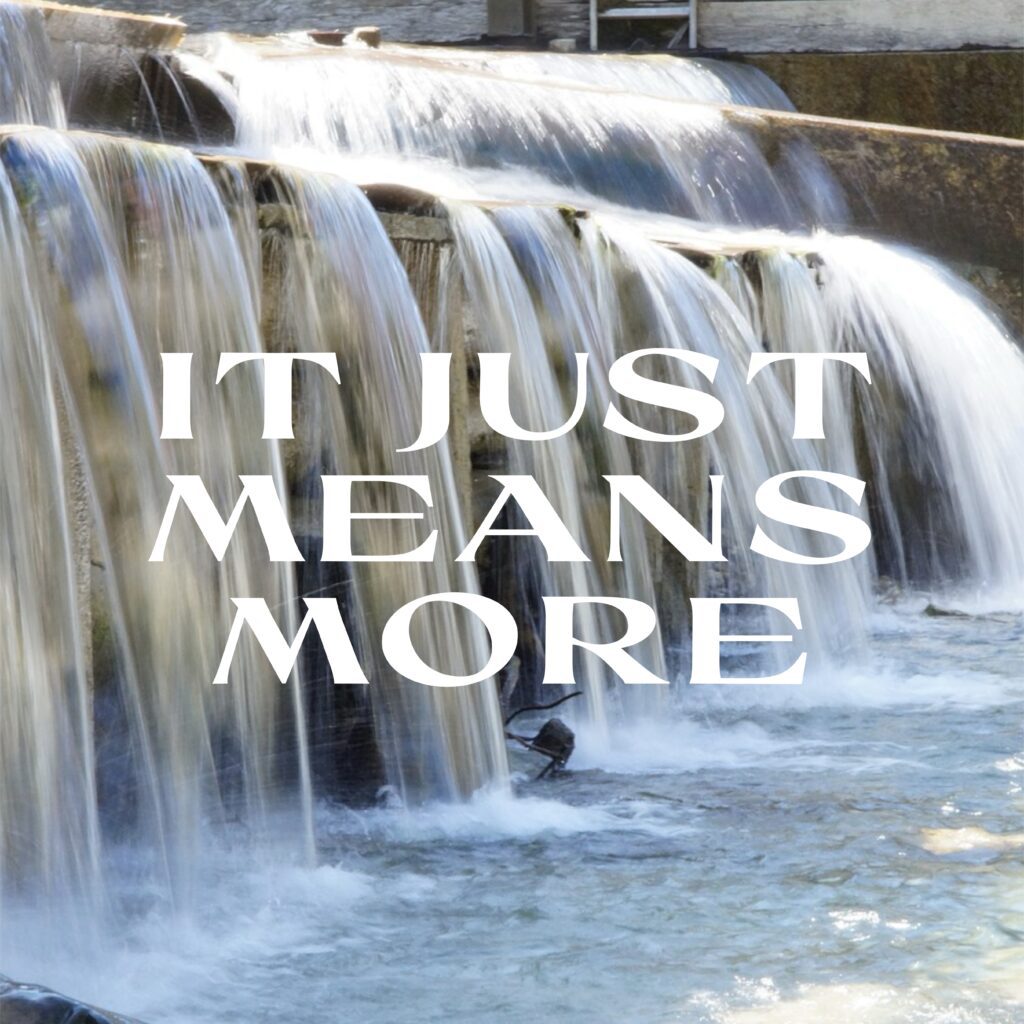A waterfall with the words it just means more written in front of it.