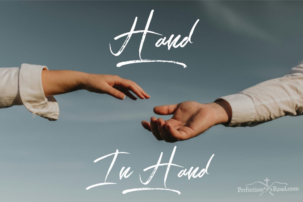 Two hands reaching out to each other in the sky.